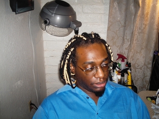 Nulocs I did. He has dreadlocks and I put yarn over them to make them longer!